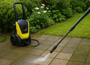 Nettoyeur haute pression sur une terrasse, lance en cours d’utilisation